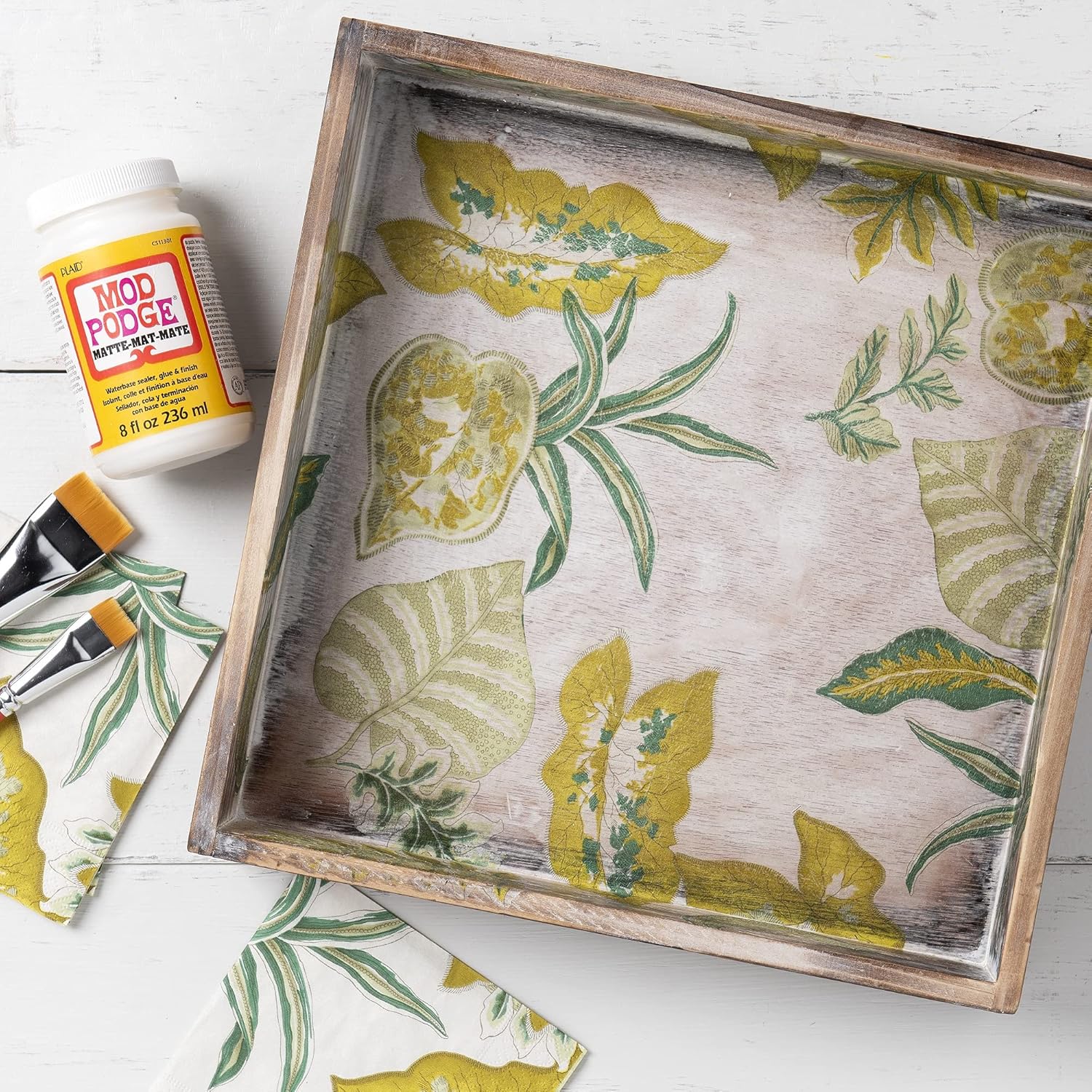 Mod podge glue used for a paper decoupage craft project